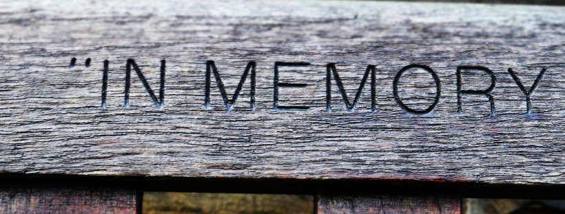 Dealing with death after you've lost a child - a weathered timber engraved with "In Memory"