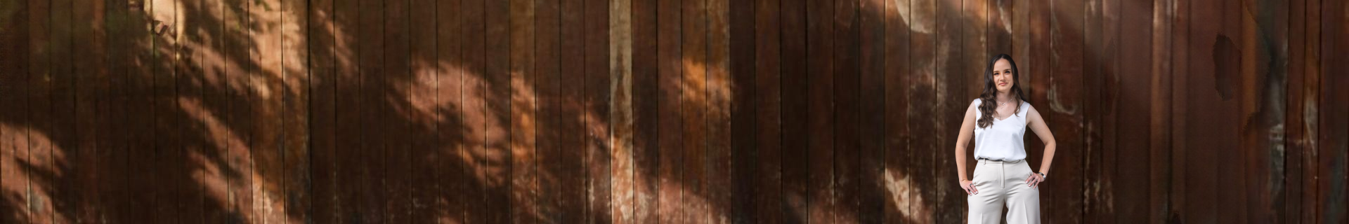Abigail Burton against a dark timber background